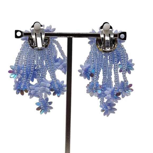 Whimsical iridescent blue beaded flower clip on earrings - Picture 4 of 6